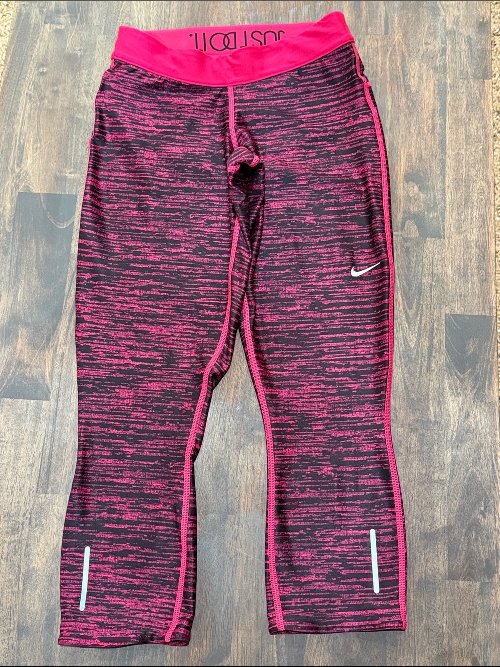Nike women’s Black and Hot Pink Space-Dye Active Leggings
